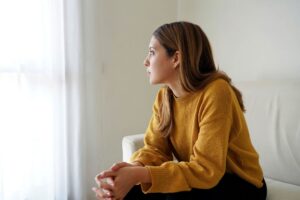 woman looking out window